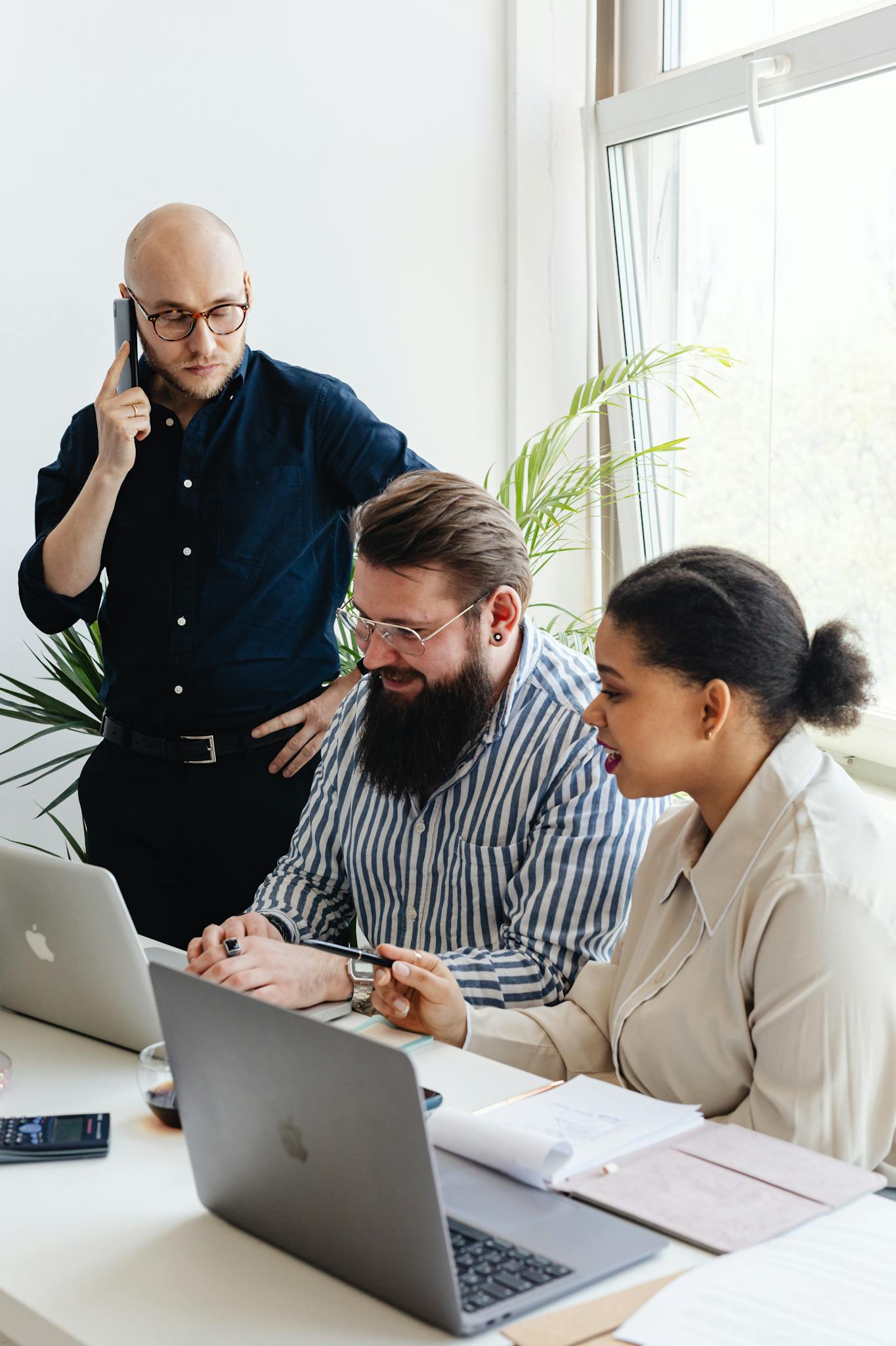 A diverse team of professionals collaborating in a modern office